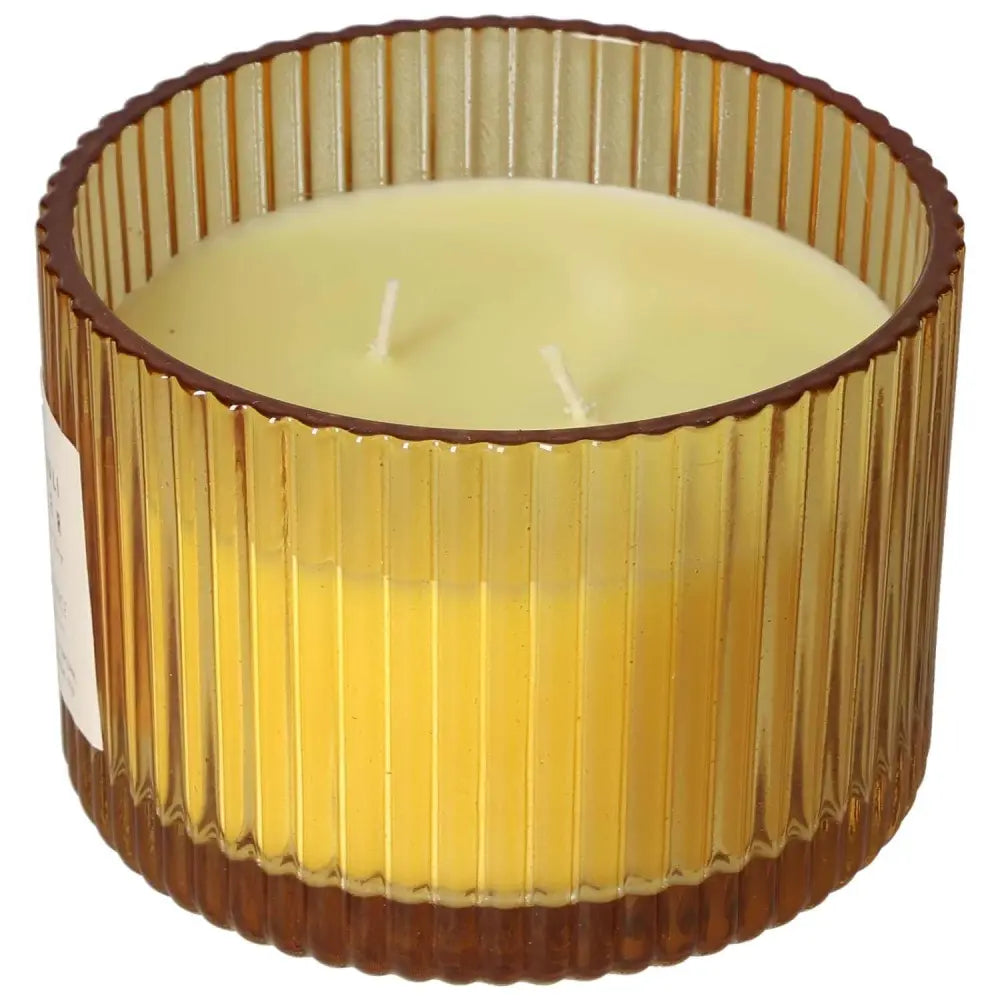 Patchouli Amber Scented Candle with ribbed amber glass, crafted from eco-friendly soy wax, offering a clean burn and luxurious fragrance.