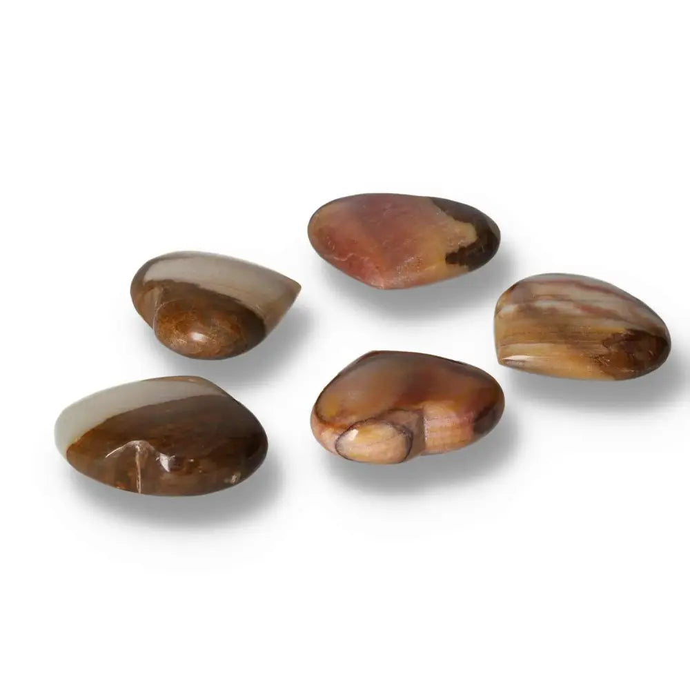 Polished peach calcite stones showcasing natural variations in color and texture, promoting inner peace and emotional renewal.