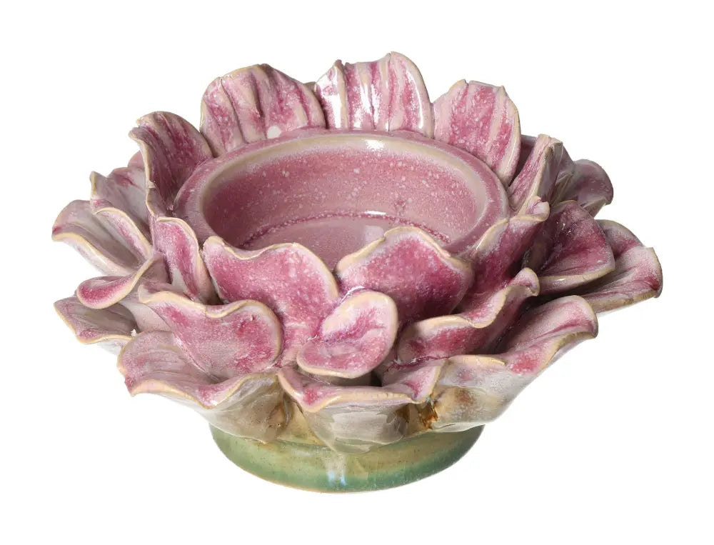 Pink stoneware flower motif candle holder by Sylvia Crystals, blending luxury with mindfulness, featuring exquisite floral design.