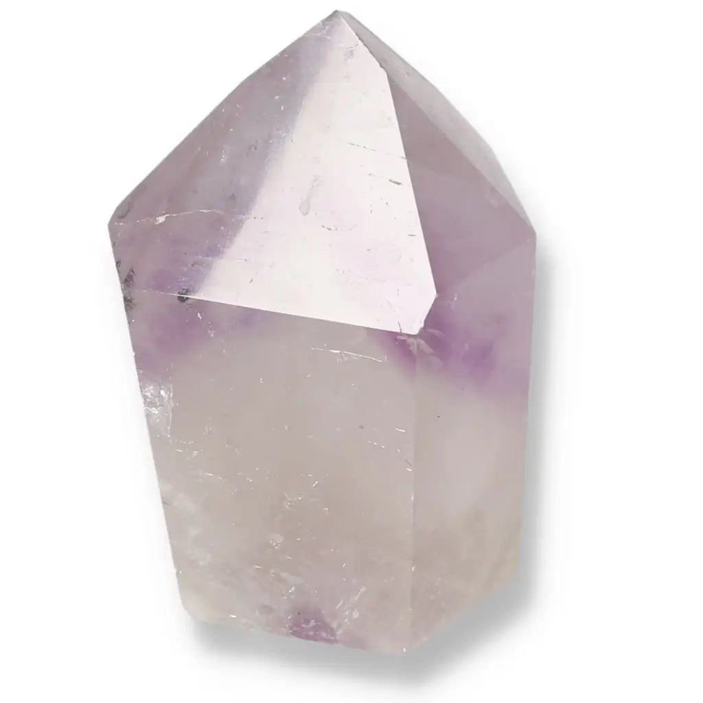 Polished Amethyst Obelisk by Sylvia Crystals, known for stress reduction and luxury appeal, showcasing a harmonious blend of beauty and spirituality.
