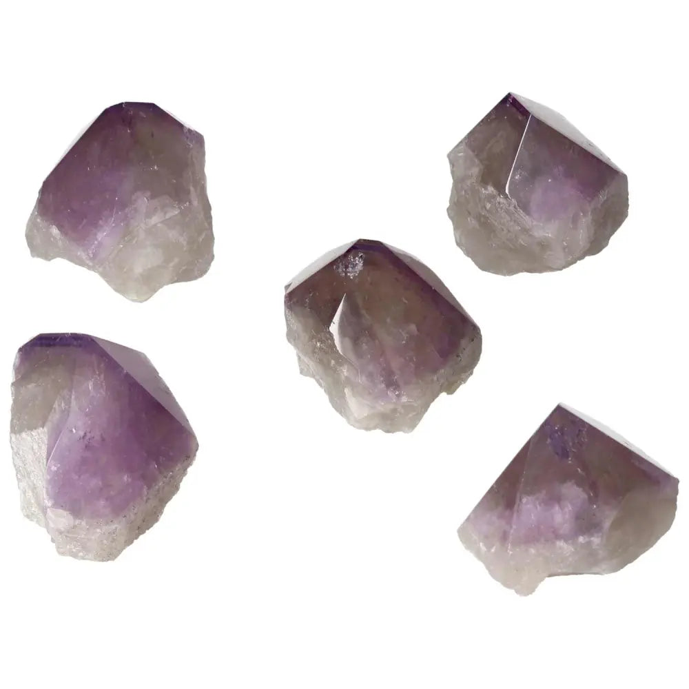 Collection of polished Point Amethyst crystals with rich purple hues from Sylvia Crystals, symbolizing tranquility and elegance.