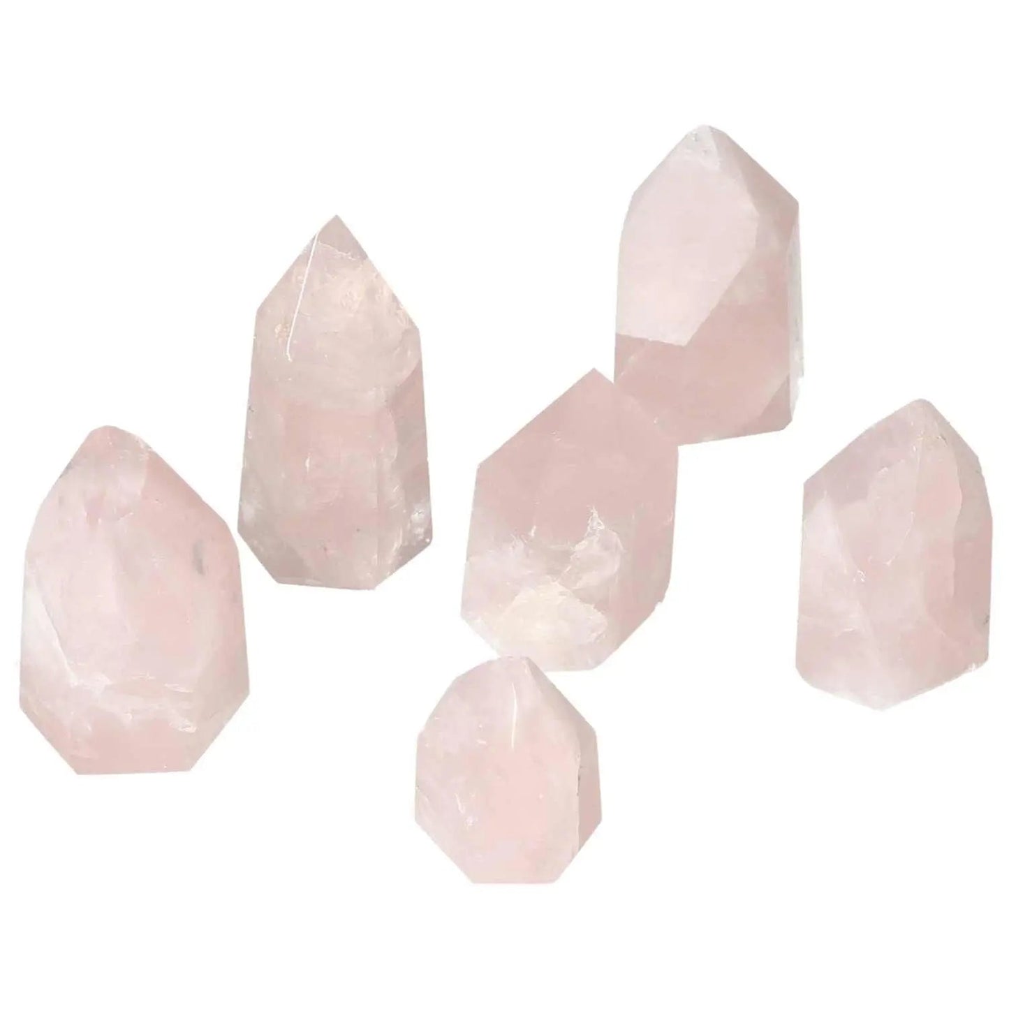 Collection of polished rose quartz obelisks, showcasing natural pink hues, ideal for enhancing space aesthetics and energy flow.
