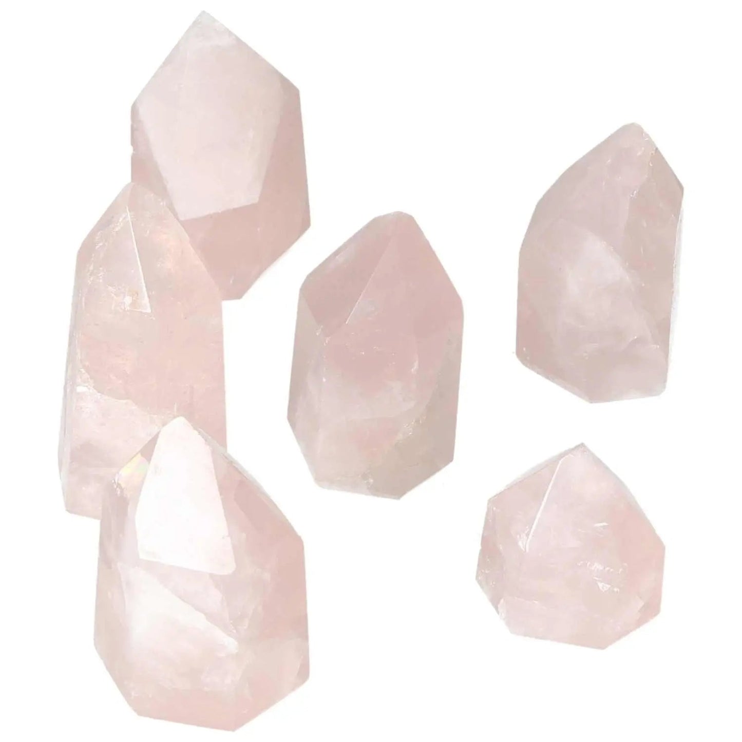 Collection of polished rose quartz obelisks, showcasing elegant pink hues and smooth finishes, perfect for enhancing space and energy flow.