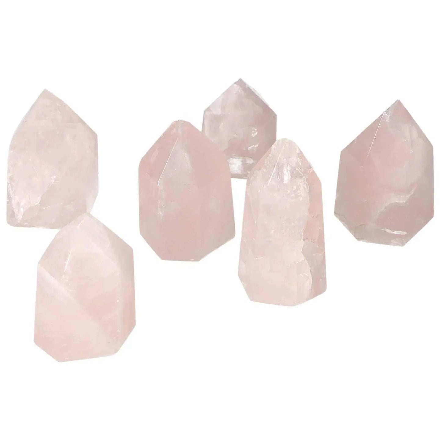 Set of six Polished Rose Quartz Obelisks XS, showcasing elegance and natural beauty by Sylvia Crystals, perfect for home decor.
