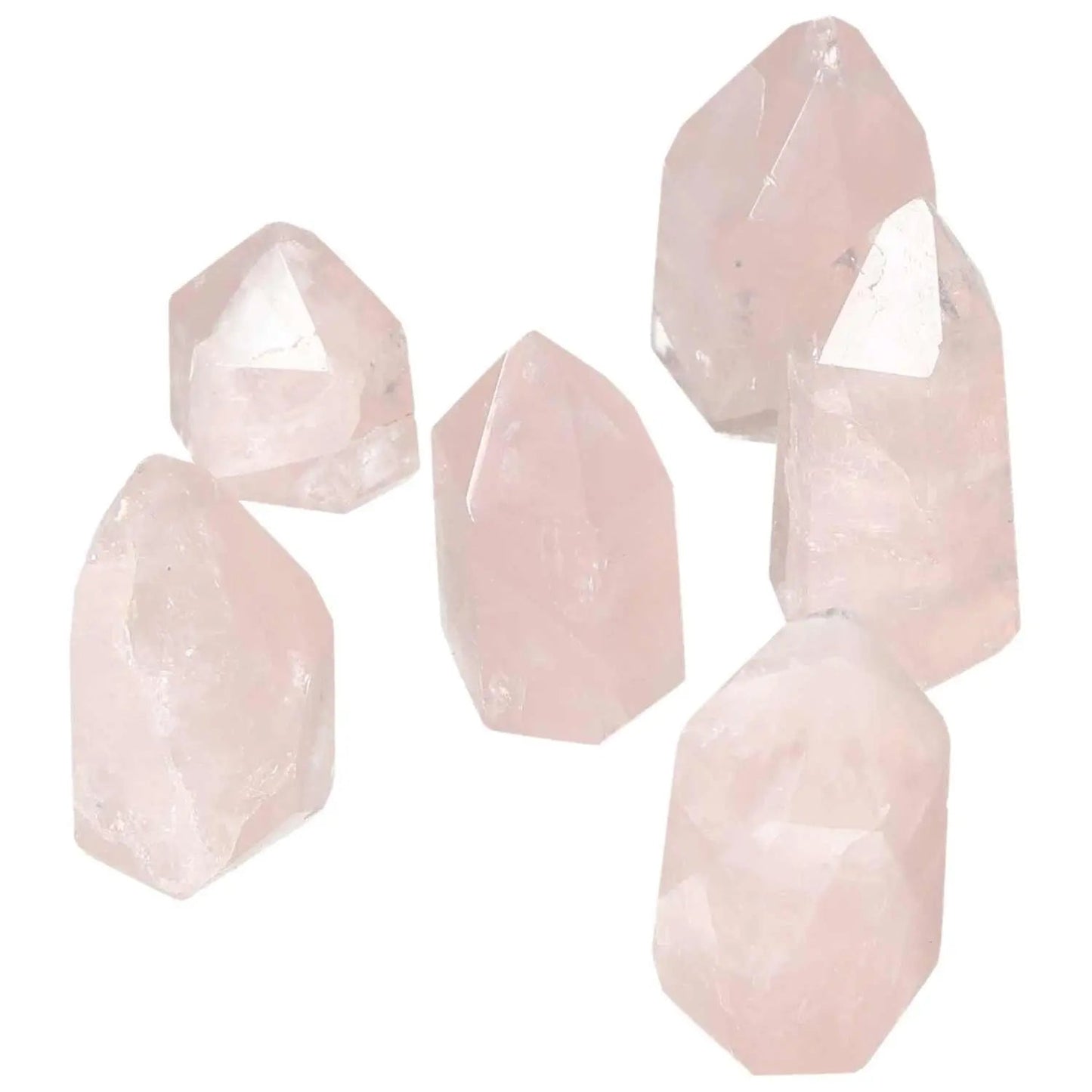 Collection of Polished XS Rose Quartz Obelisks by Sylvia Crystals, enhancing spiritual energy and aesthetic appeal with natural elegance.