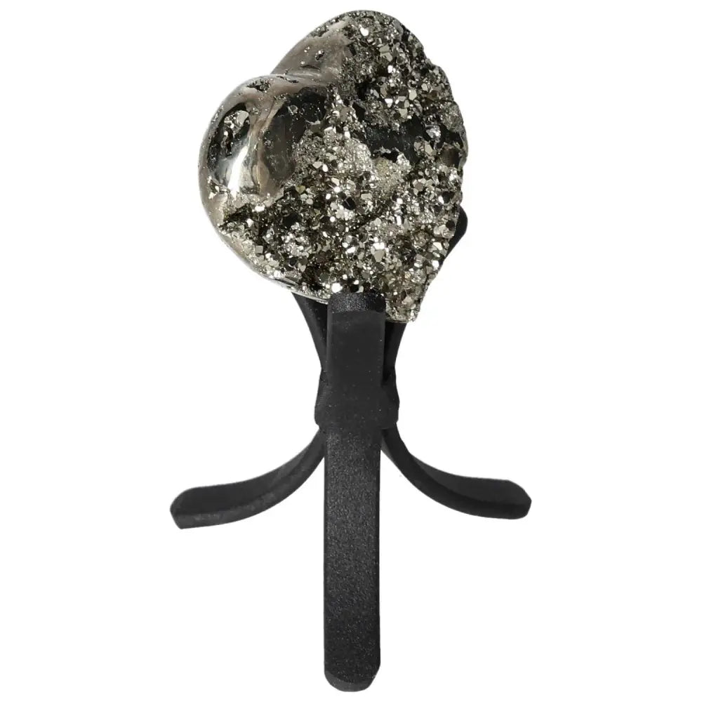 Polished pyrite heart shape on stand, showcasing golden luster and grounding energy for home decor or crystal collection.