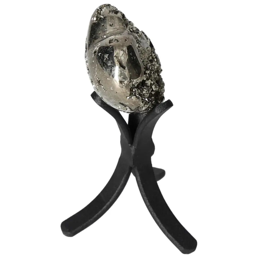 Polished pyrite heart on stand showcasing golden luster and grounding energy for home decor.