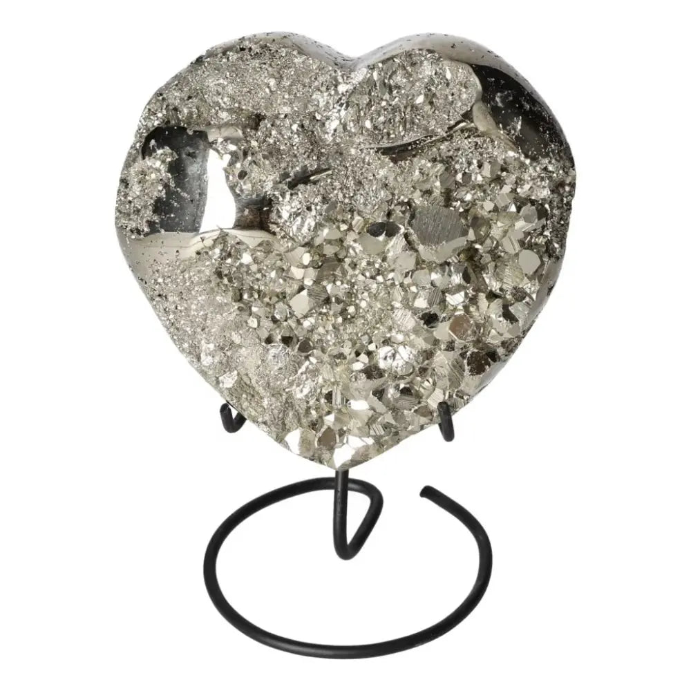 Polished pyrite heart shape with golden luster on stand, showcasing grounding energy and elegant design.