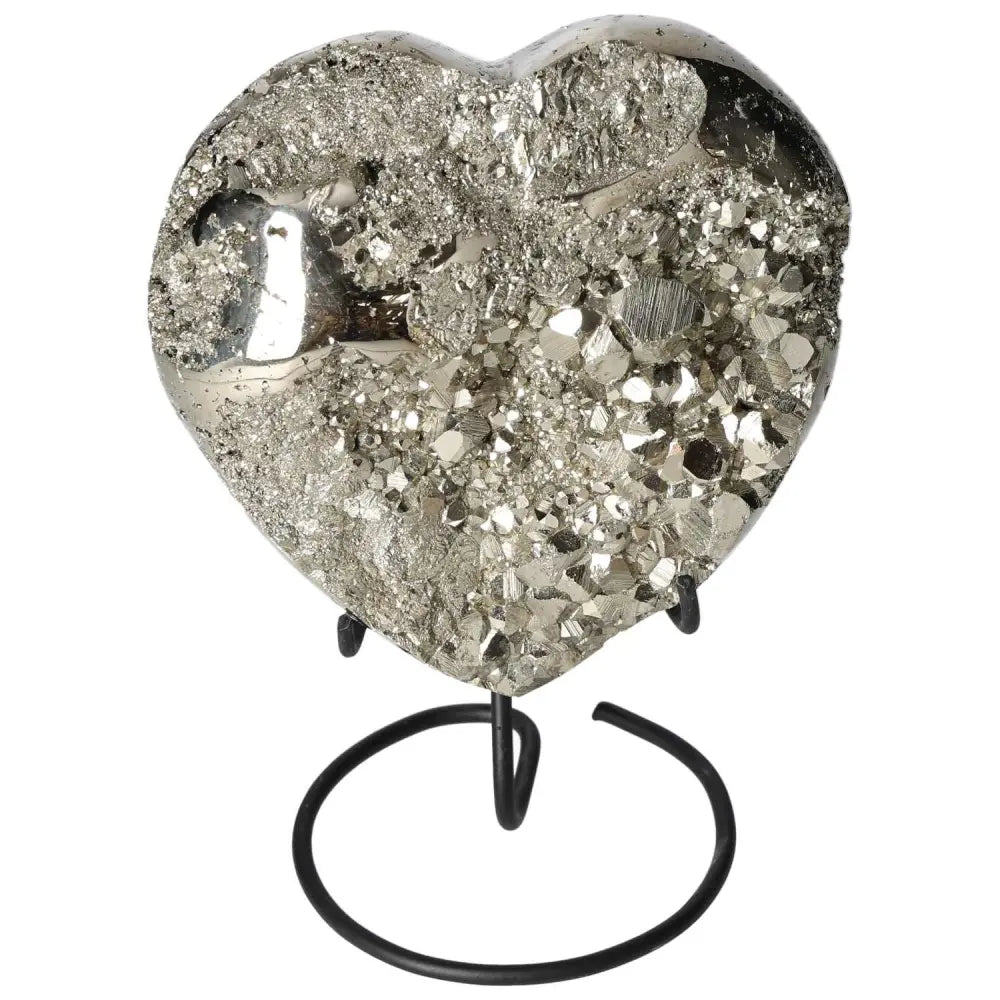 Polished pyrite heart sculpture with golden luster on a stand, showcasing radiant energy and grounding power.
