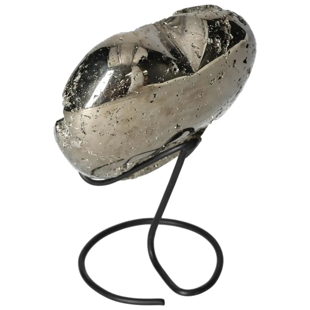 Polished pyrite heart on a metal stand, showcasing its golden luster and grounding energy for decorative and spiritual purposes.