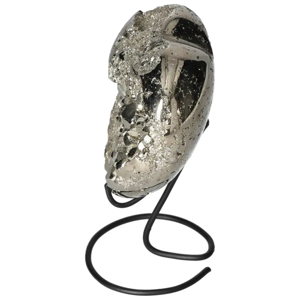 Polished pyrite heart on a stand showcasing its golden luster and raw beauty.