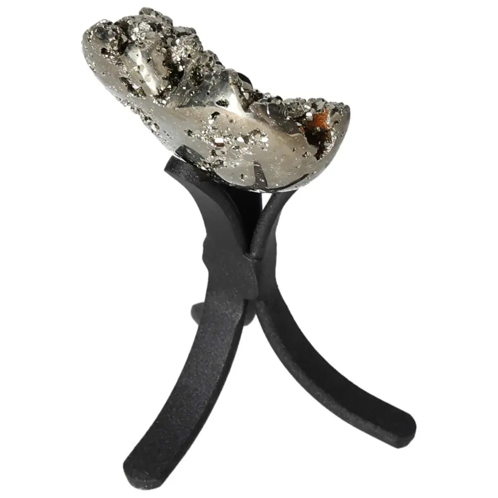 Polished pyrite sculpture on a black display stand, showcasing its golden luster and unique formation.