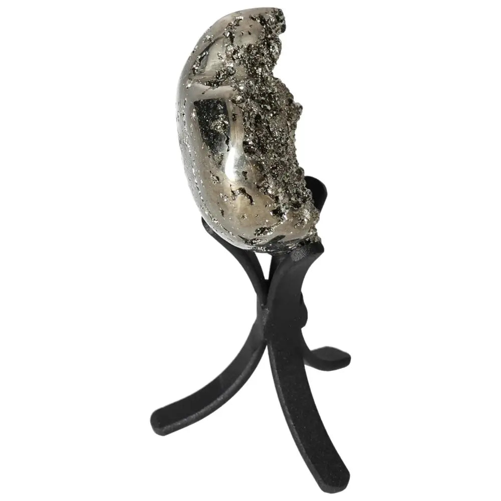 Polished pyrite heart on stand showcasing golden luster and grounding energy.