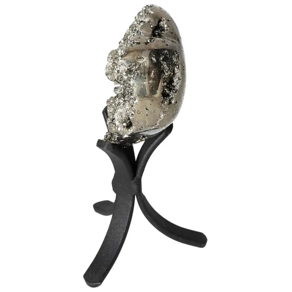 Polished pyrite heart on stand showcasing golden luster and grounding energy, ideal for elevating space and intention.
