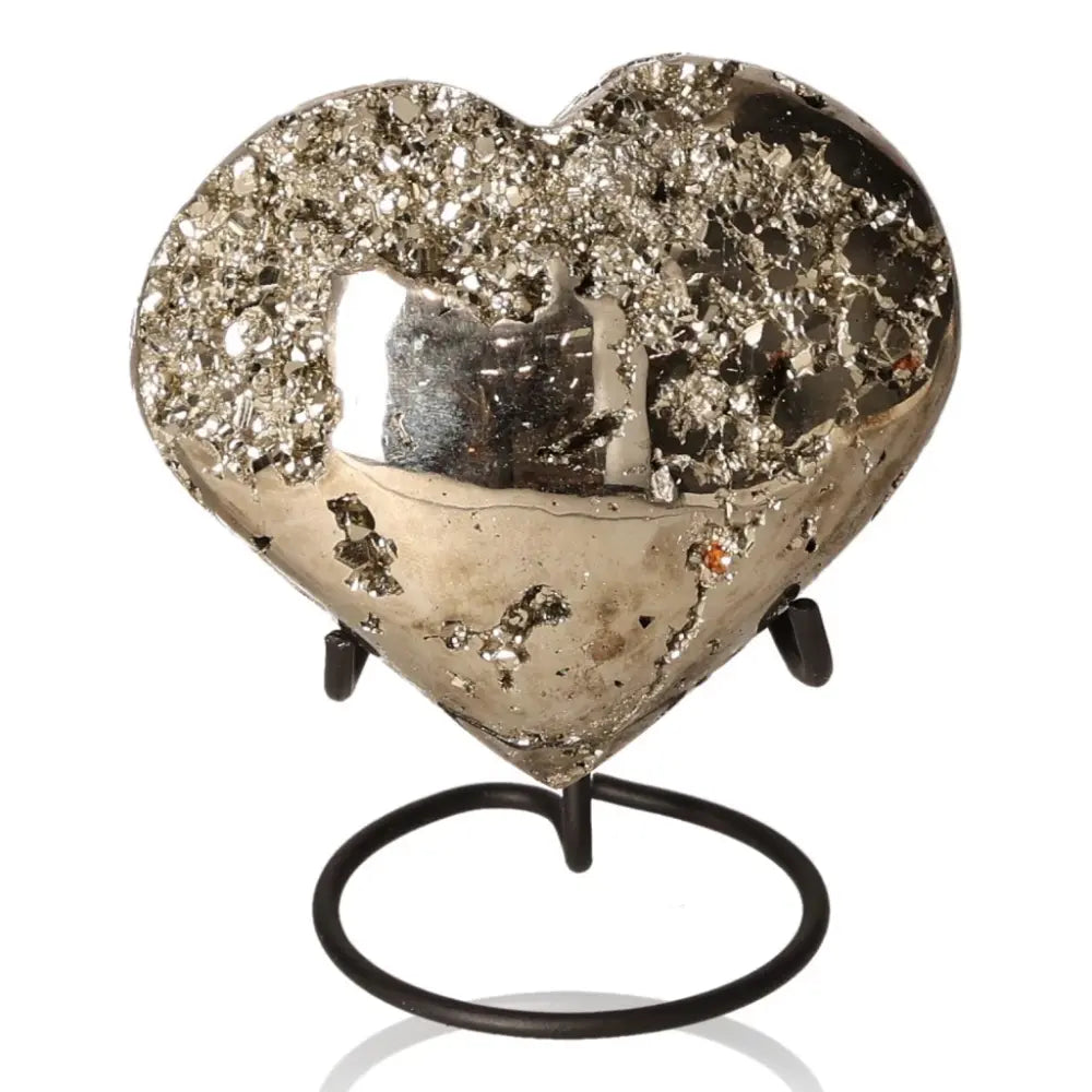 Heart-shaped pyrite sculpture on stand, showcasing its metallic luster and golden hue, symbolizing abundance and prosperity.