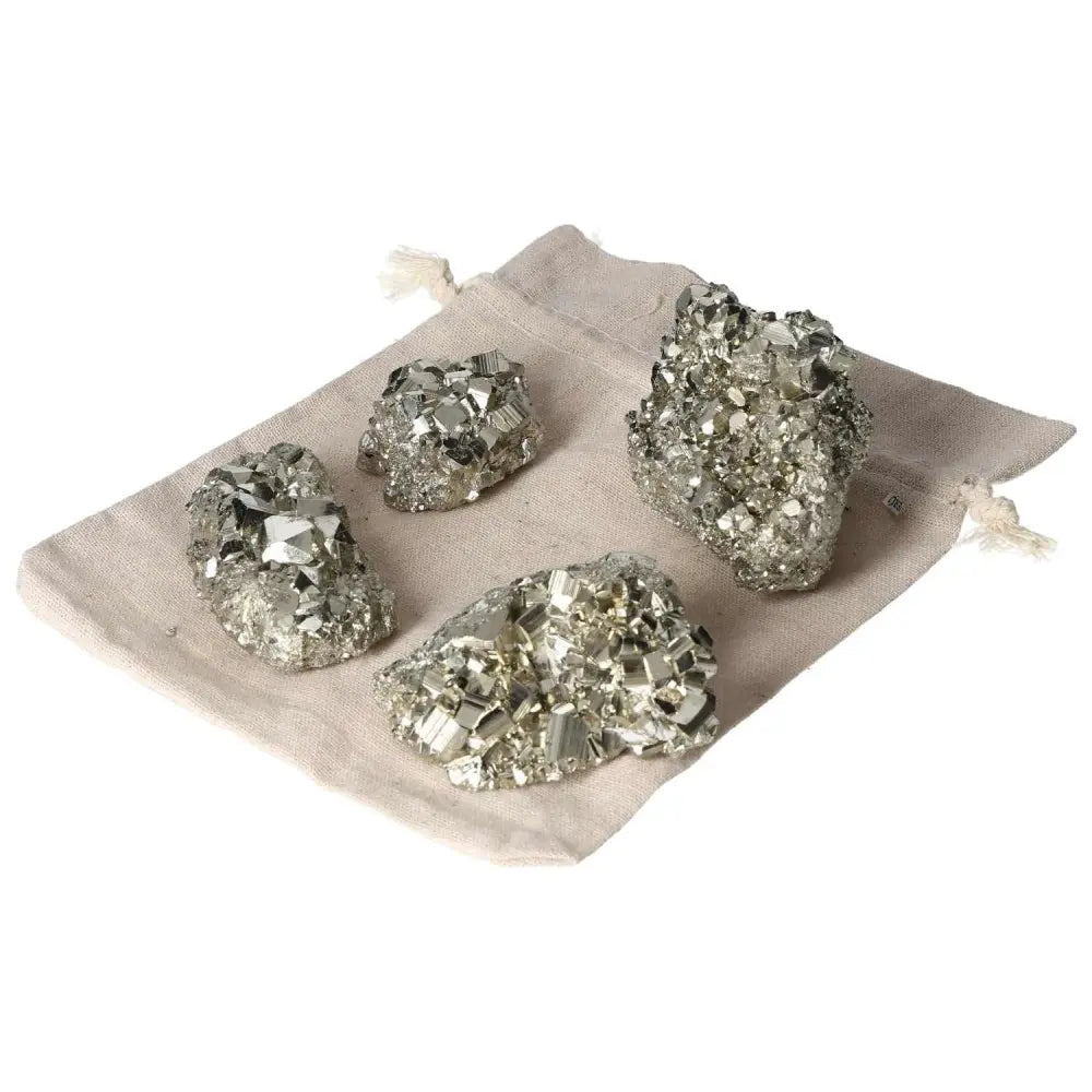 Rough pyrite clusters on fabric bag showcasing geometric formations and metallic luster, premium quality, 1 kg, 2 pieces.