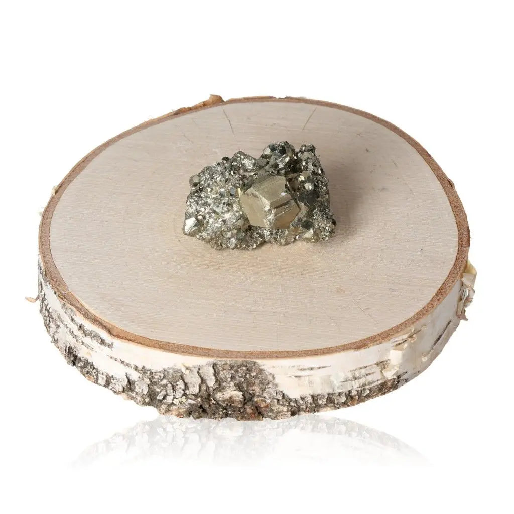 Pyrite druzy on a wooden base, showcasing its golden hue and metallic luster, symbolizing abundance and prosperity.