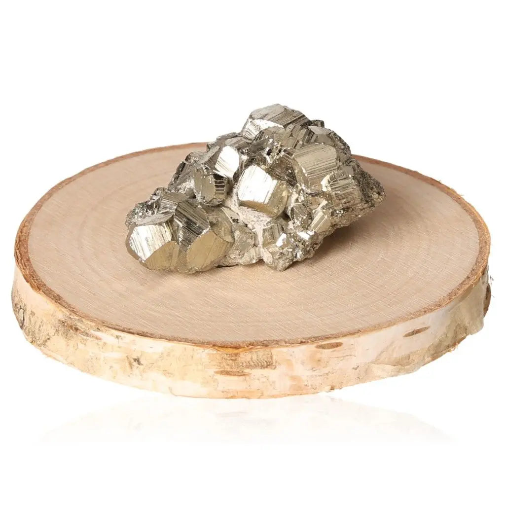 Pyrite druzy displaying metallic luster on a wooden base, symbolizing abundance and prosperity.