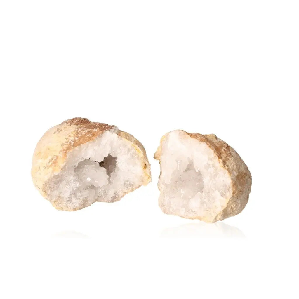 Quartz geode split open, revealing cloudy white crystals inside, showcasing its elegance and purifying energy.