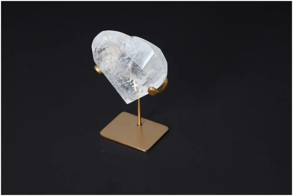 Quartz Geometric Heart on a stand, showcasing the clear stone's purification properties and ability to harmonize energy.