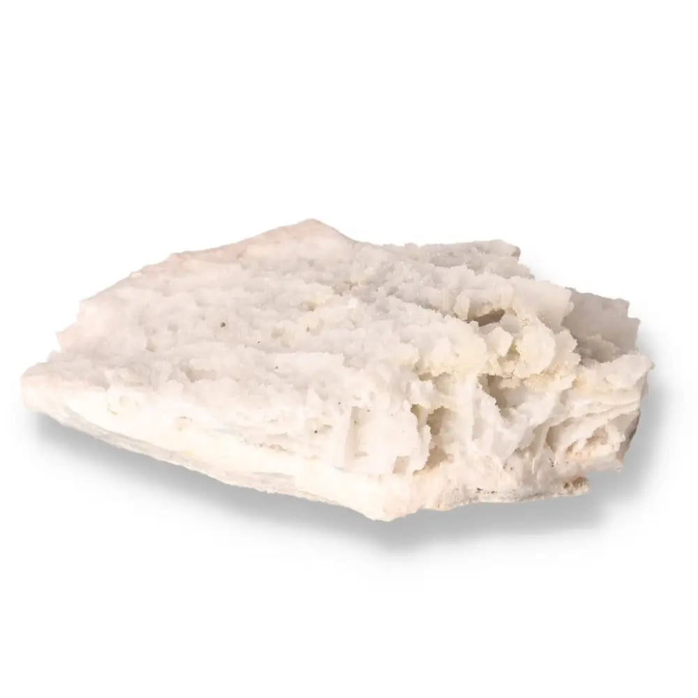 Close-up of a raw white quartz crystal with textured surface showcasing natural beauty and unique versatility.