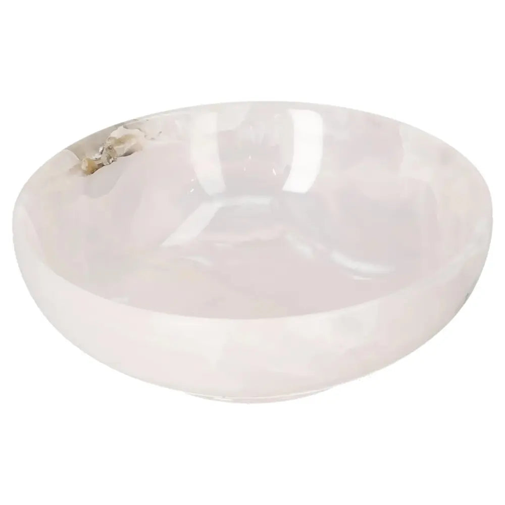 Rose Onyx Bowl with smooth polished surface, reflecting light with delicate veining. Perfect for sophisticated home decor.