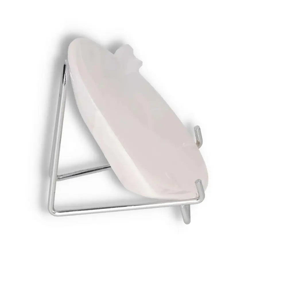 Rose Onyx Platter displayed on a silver stand, showing its smooth, polished surface and unique rose-hued color variations.