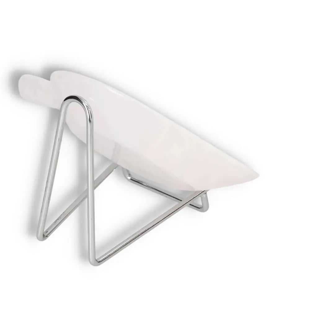 Stylish white bowl on sleek chrome stand, modern home decor