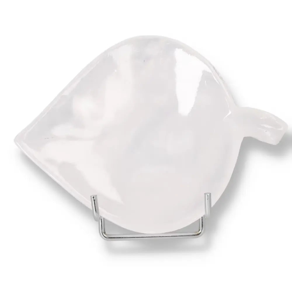 Rose Onyx Platter with smooth polished surface and unique veining, displayed on a metal stand for elegant table presentation.