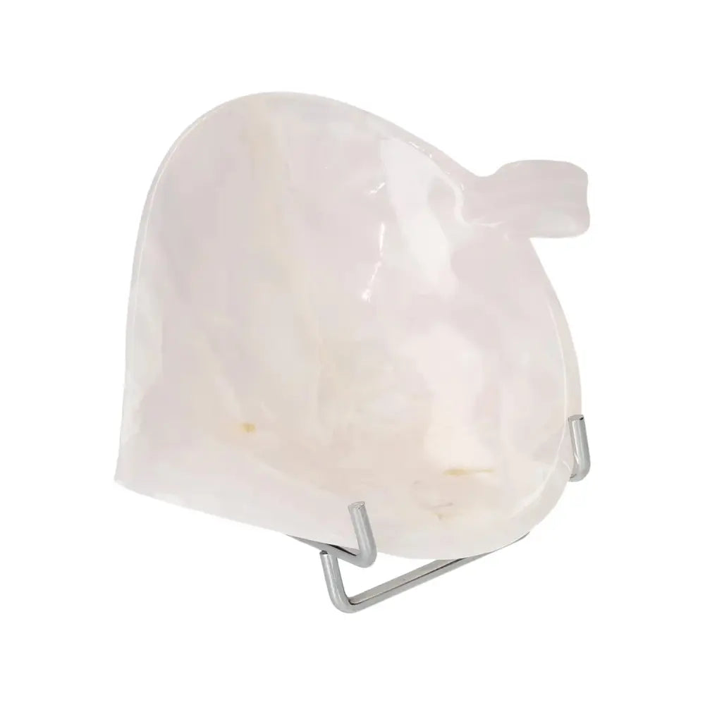 Elegant Rose Onyx platter on a minimalist display stand, showcasing its unique texture and promoting self-discipline and inner strength.