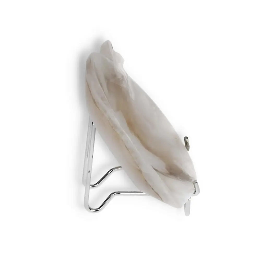 Rose Onyx Platter with unique veining displayed on a stand, reflecting elegance and natural charm, perfect for sophisticated tablescapes.
