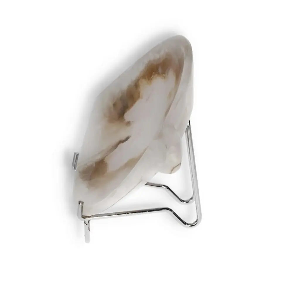 Rose onyx platter on metal stand showcasing elegant color and veining, perfect for stylish table decor.