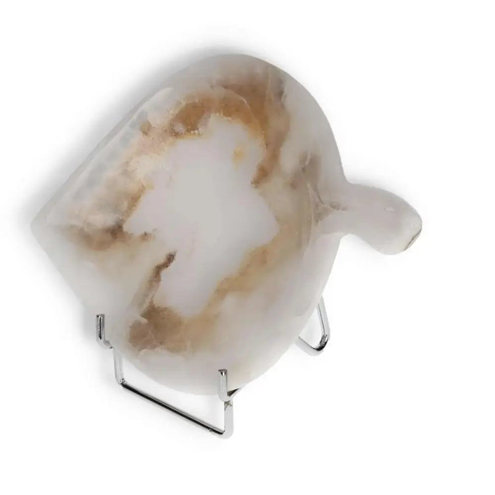 Rose onyx small platter with unique color variations on a stand, showcasing elegant veining and polished surface.