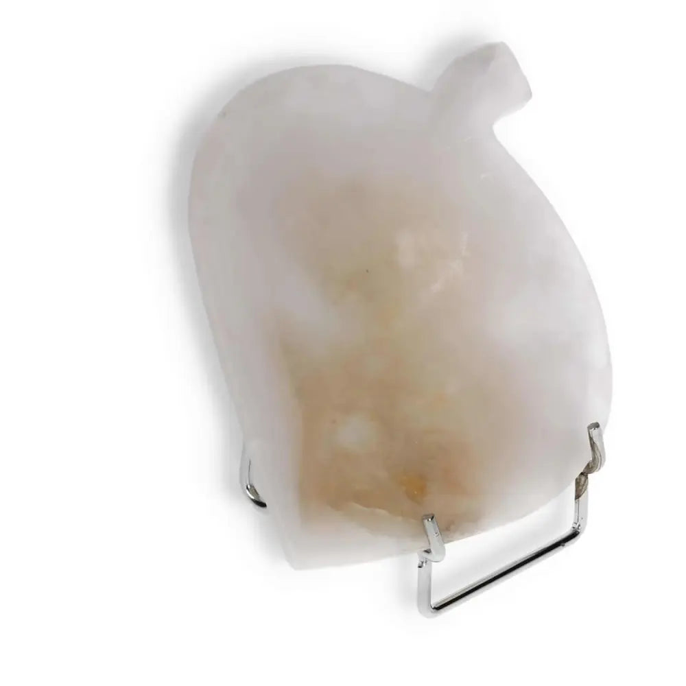 Rose onyx platter with unique color variations displayed on a metal stand, showcasing its polished surface and natural elegance.