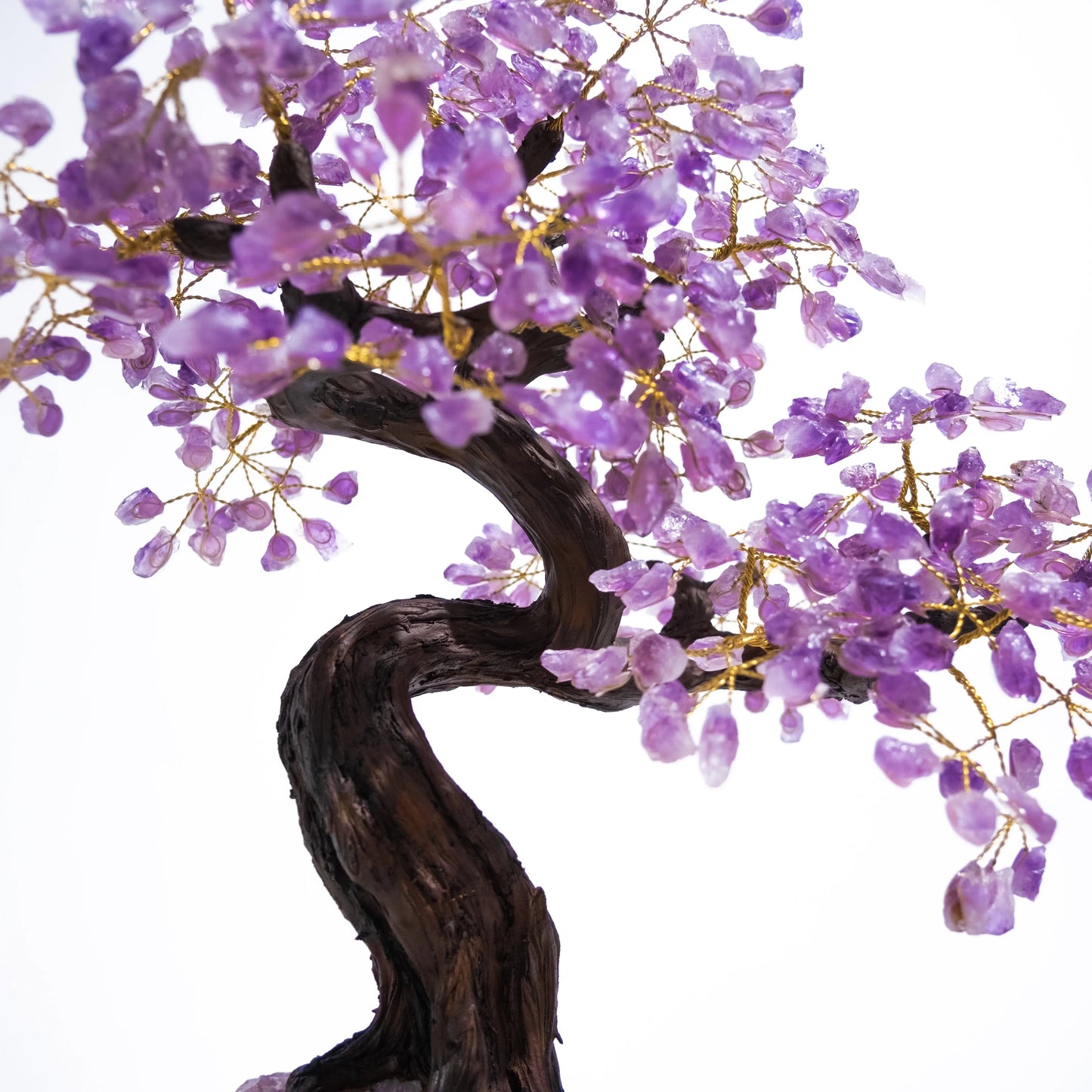 Amethyst crystal bonsai tree with purple gemstone leaves, promoting calming energy and spiritual harmony, 55 cm tall.