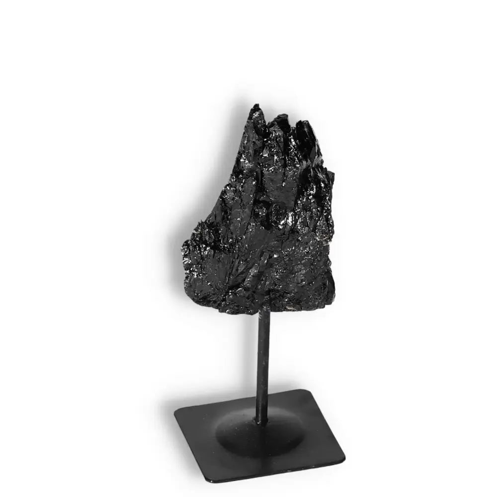 Rough Black Tourmaline on Metal Stand, premium Sylvia Crystals product for energy cleansing and transformation.
