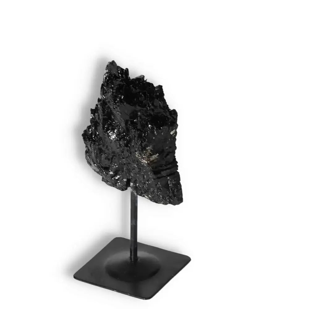 Rough Black Tourmaline on Metal Stand S by Sylvia Crystals, known for energy cleansing and aesthetic appeal.