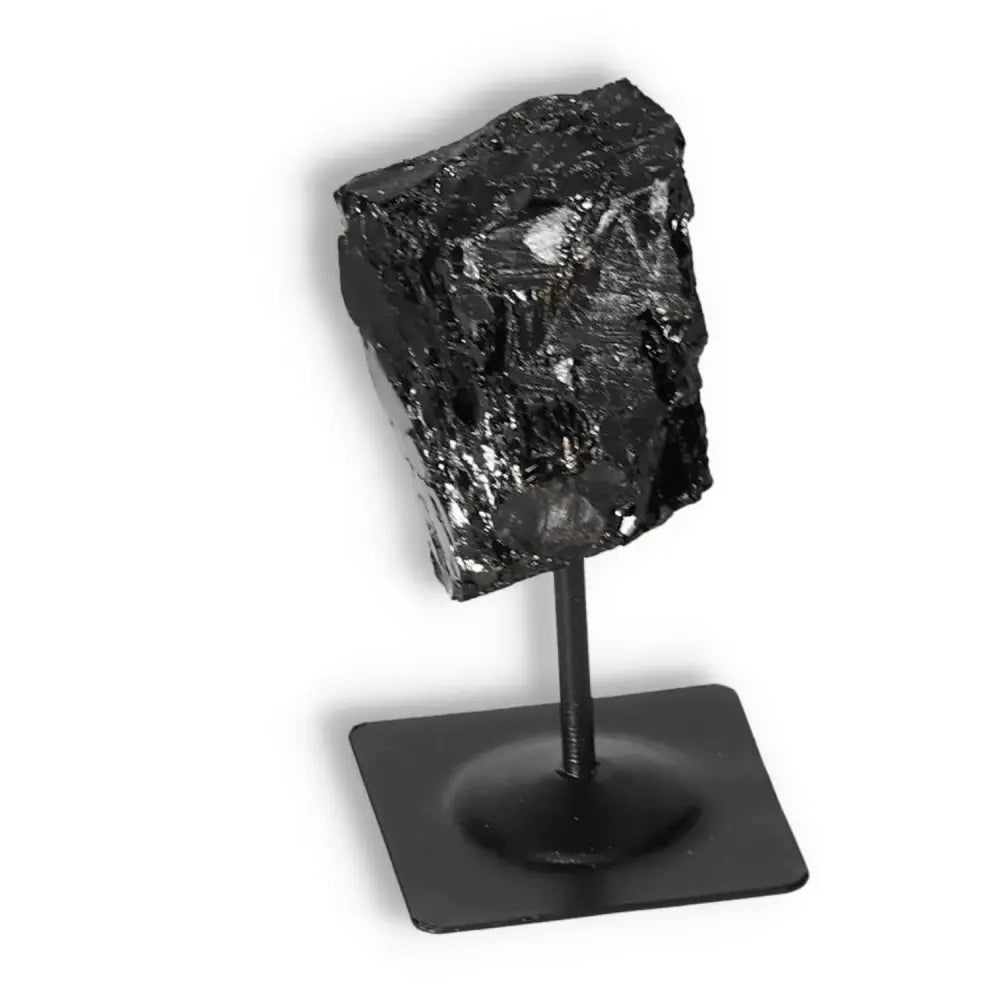 Rough Black Tourmaline with Metal Stand S from Sylvia Crystals, showcases natural elegance and cleansing energy potential.