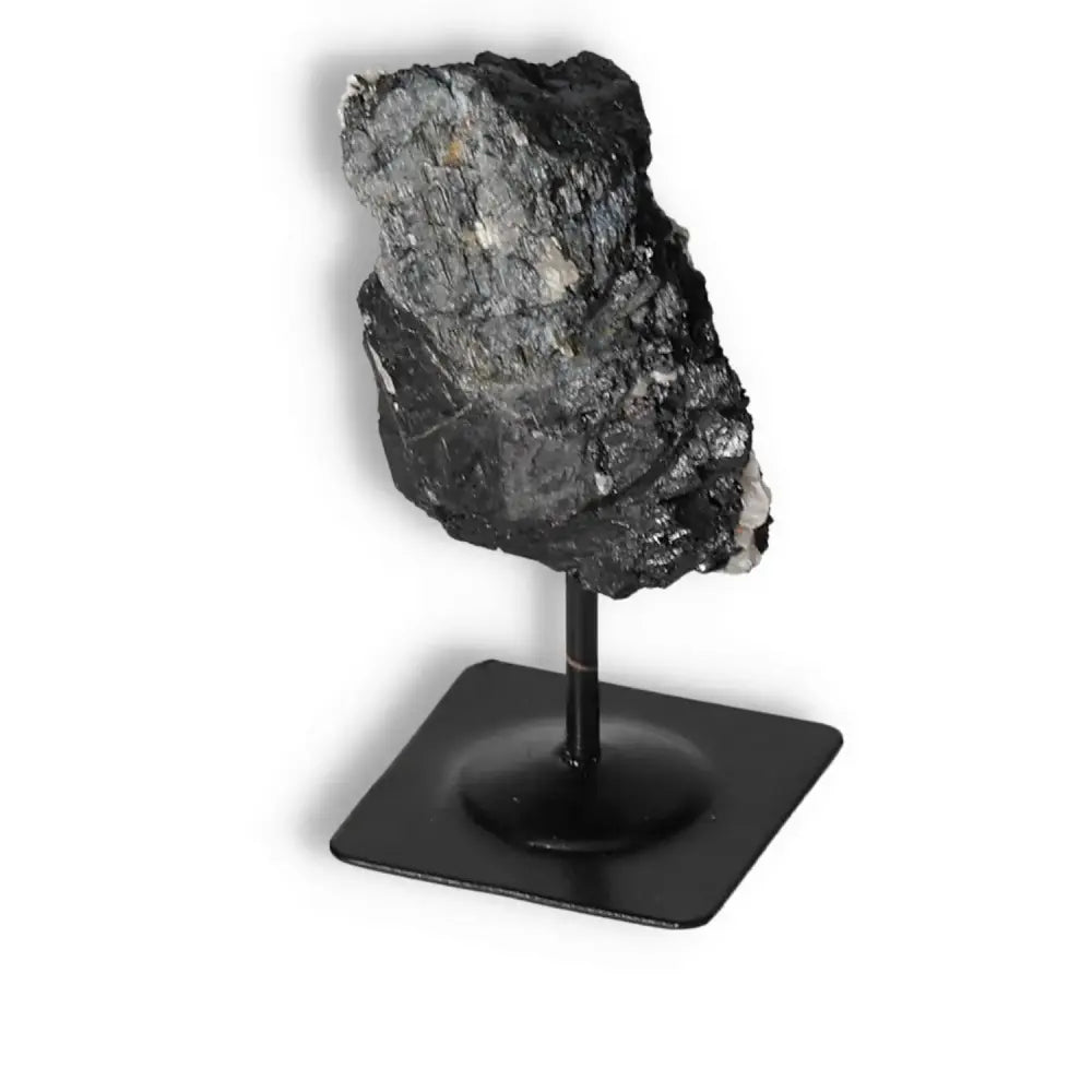 Rough Black Tourmaline on Metal Stand, renowned for cleansing properties, from Sylvia Crystals - high-quality and authentic.