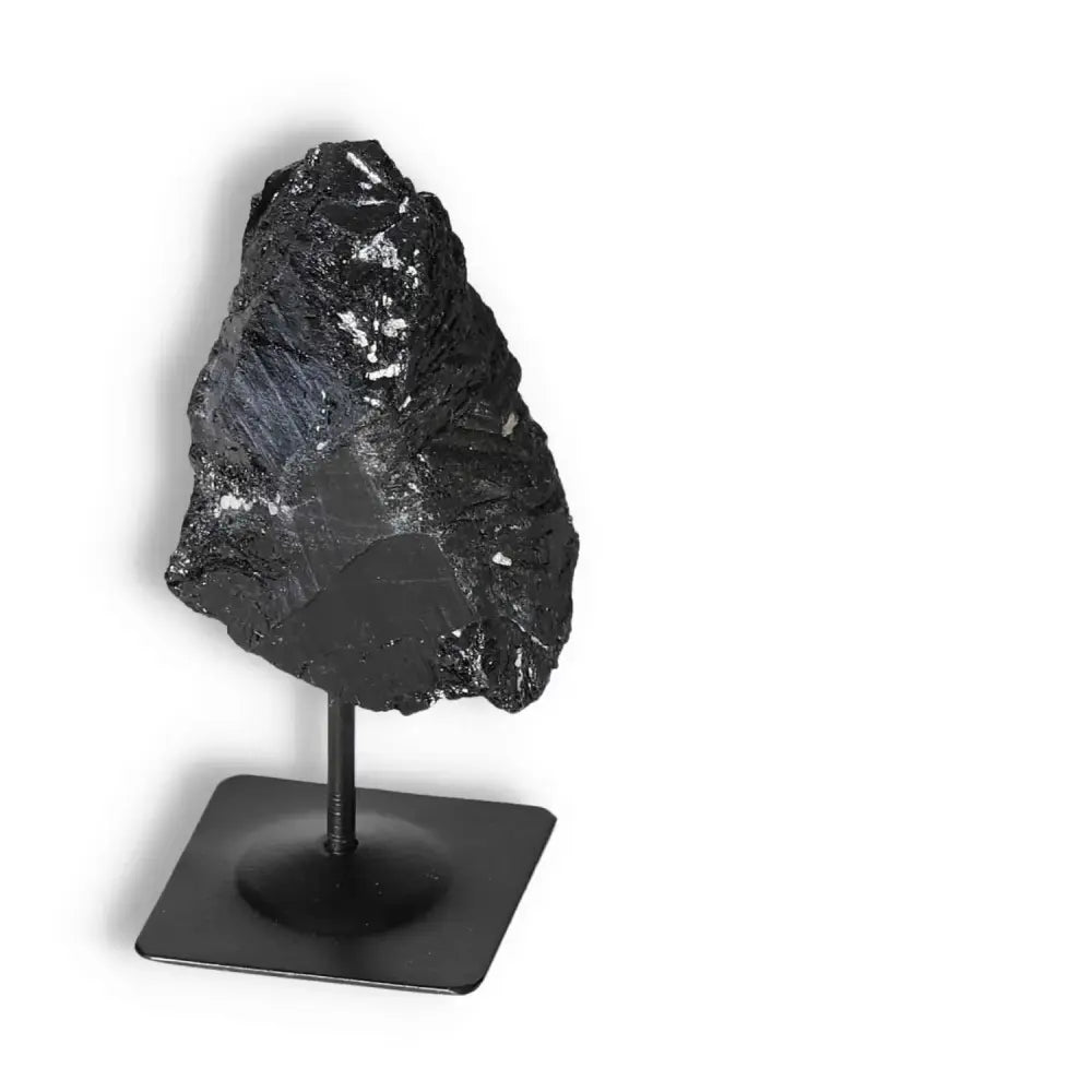 Rough Black Tourmaline on Metal Stand S by Sylvia Crystals for energy cleansing and protection against negativity.