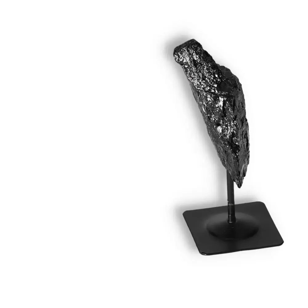 Rough Black Tourmaline on Metal Stand S from Sylvia Crystals, ideal for energy cleansing and transformation.