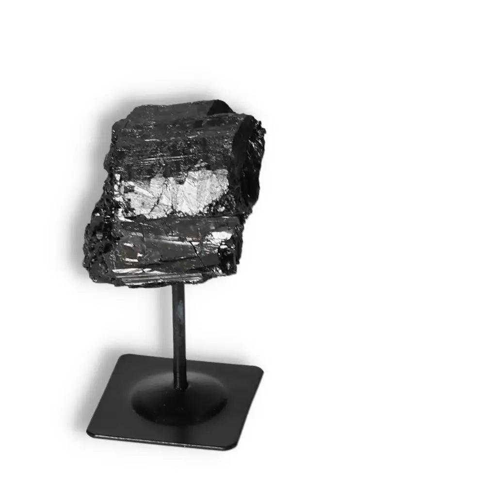 Rough Black Tourmaline with Metal Stand S for energy cleansing and spiritual grounding from Sylvia Crystals.