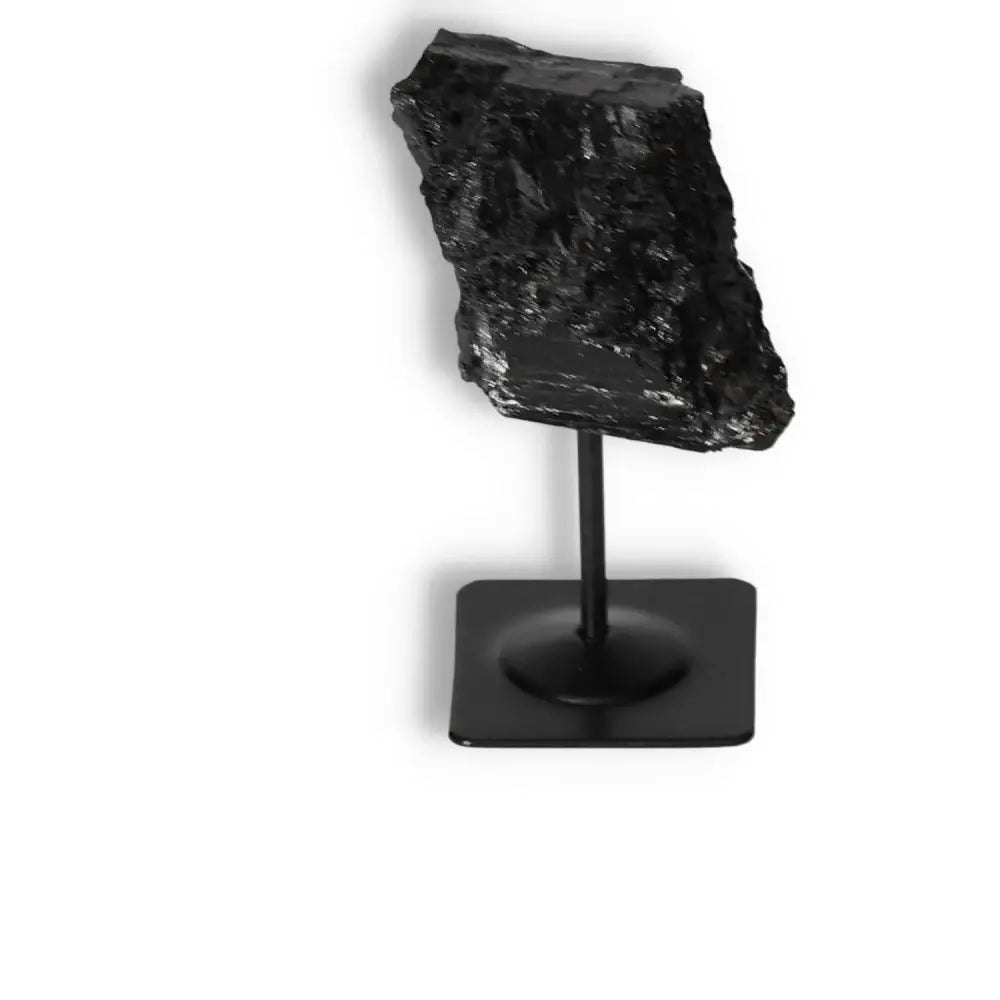 Rough Black Tourmaline on Metal Stand, a premium crystal for cleansing negative energies and enhancing mental wellness, by Sylvia Crystals.