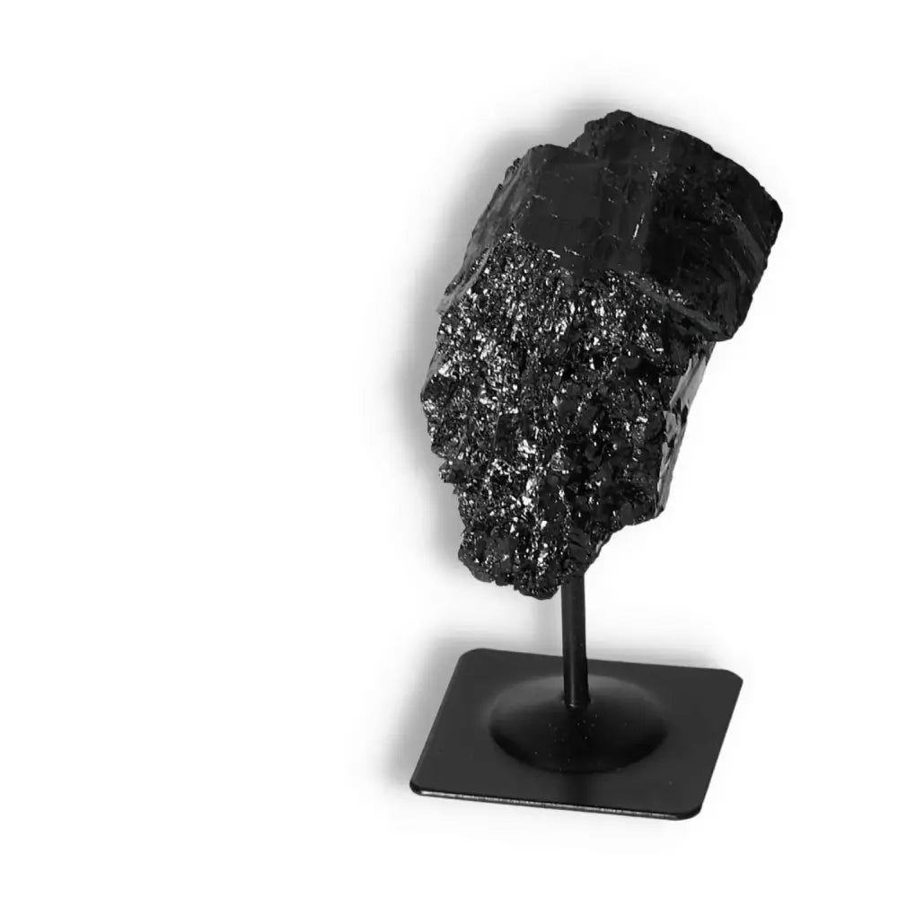 Rough Black Tourmaline with Metal Stand S, premium crystal from Sylvia Crystals, known for cleansing negative energies and spiritual grounding.