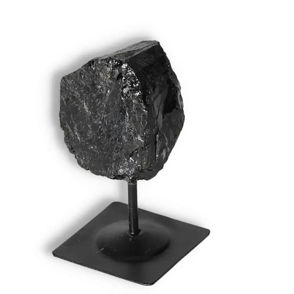 Rough Black Tourmaline on Metal Stand; luxury crystal for energy cleansing and grounding from Sylvia Crystals.