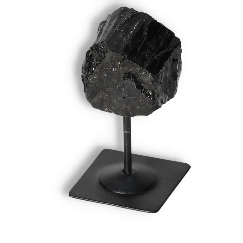 Rough Black Tourmaline on Metal Stand S for energy cleansing by Sylvia Crystals, featuring grounding properties and luxury design.
