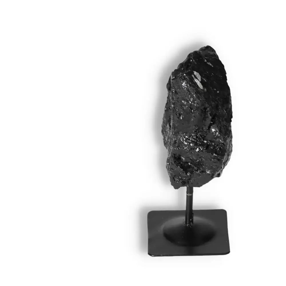 Rough Black Tourmaline with Metal Stand S by Sylvia Crystals, known for energy cleansing and mental stability enhancement.