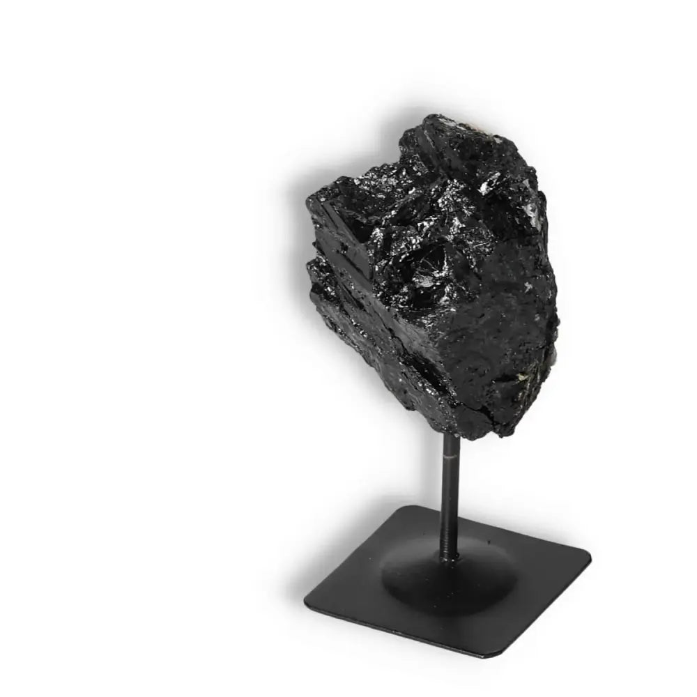 Premium Rough Black Tourmaline on Metal Stand from Sylvia Crystals, a natural protector and energy transformer for home or office.