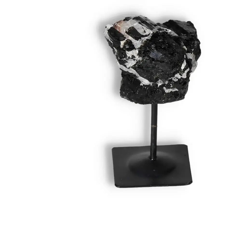 Rough Black Tourmaline on Metal Stand S from Sylvia Crystals, known for neutralizing negative energies, elegant crystal décor piece
