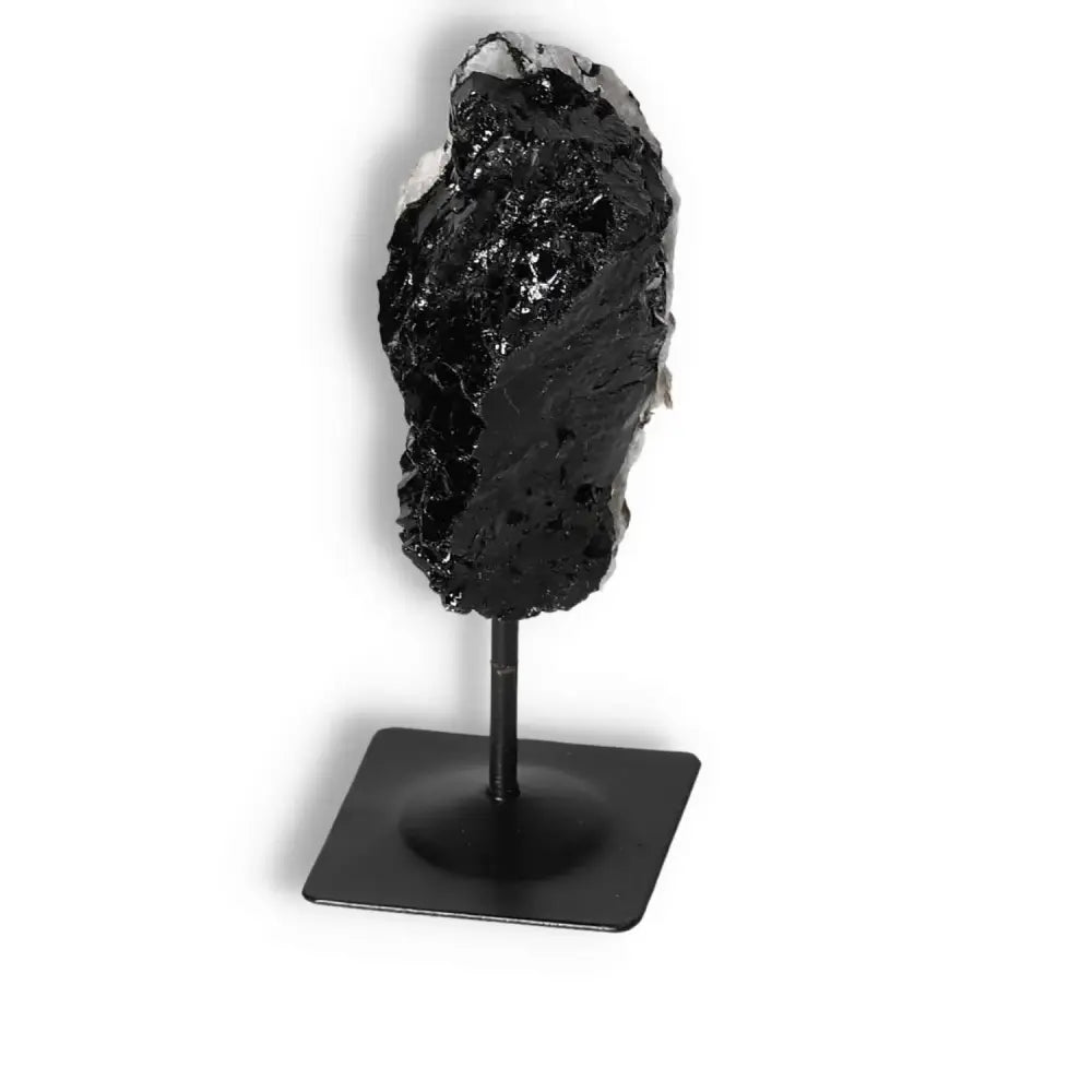 Rough Black Tourmaline with Metal Stand S, premium crystal from Sylvia Crystals, known for shielding against negative energies.
